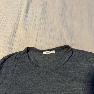 Buck Mason navy blue slub cotton tee shirt.